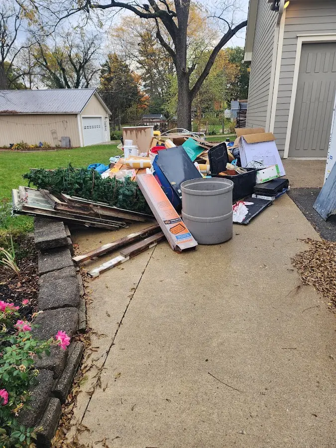 Dumpster being loaded with debris for Commercial Dumpster Rental in Norristown
